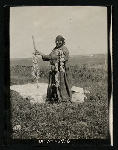 Woman with String of Prairie Turnips