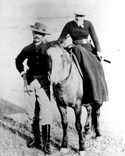 Marquis and Medora on horseback