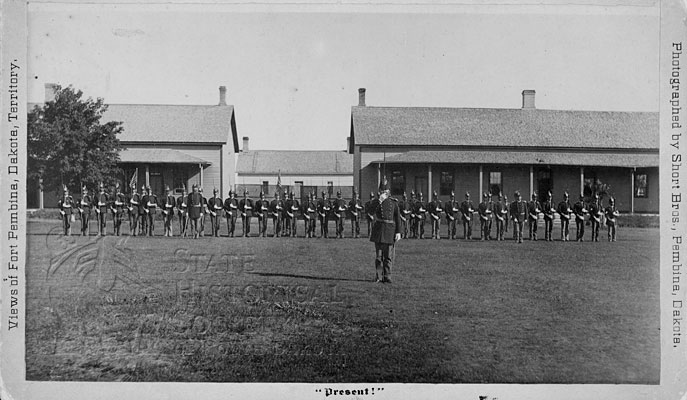 Soldiers present arms,  Fort Pembina, DT