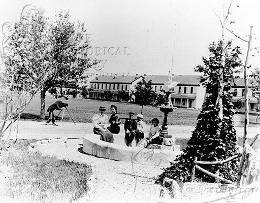 group sitting at fountain