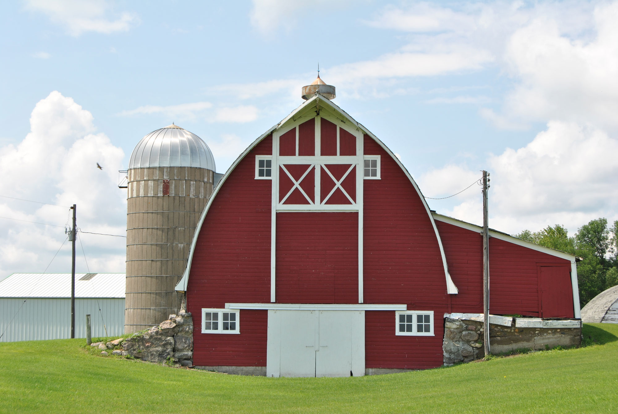 Red barn with white doors and trim